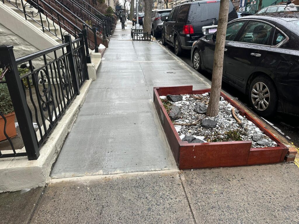 a well repaired sidewalk in residential area